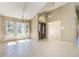Open-concept foyer with tile floor, decorative chandelier, and many windows bringing in natural light at 1306 Pleasantridge Pl, Orlando, FL 32835