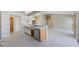 Open kitchen with a combination of light colored counter tops and white tile flooring at 1306 Pleasantridge Pl, Orlando, FL 32835