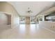 Spacious living area with tile flooring, sliding glass doors to the backyard, and open layout at 1306 Pleasantridge Pl, Orlando, FL 32835