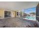 Covered outdoor patio next to screened in pool with great exterior views at 1306 Pleasantridge Pl, Orlando, FL 32835