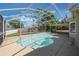 Inviting pool area with a screened enclosure, offering privacy and a refreshing outdoor experience at 1306 Pleasantridge Pl, Orlando, FL 32835