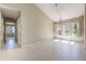 Open room featuring tile flooring, natural light, high ceilings and views through to other spaces at 1306 Pleasantridge Pl, Orlando, FL 32835