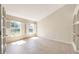 Bright room featuring tile floors, neutral walls, built-in shelving and large windows with shutter style coverings at 1306 Pleasantridge Pl, Orlando, FL 32835
