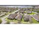 Aerial shot of a neighborhood with lake view and single-Gathering homes with well-maintained lawns at 14048 Lake Abbotts Dr, Winter Garden, FL 34787