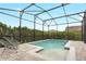 Sparkling pool with a screened enclosure offers privacy and a relaxing outdoor experience at 14048 Lake Abbotts Dr, Winter Garden, FL 34787