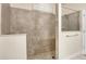 Stylish shower with gray tile at 14048 Lake Abbotts Dr, Winter Garden, FL 34787