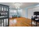 Bright bedroom with hardwood floors, chandelier, and two closets at 1500 Whitstable Ct, Lake Mary, FL 32746