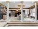 Elegant dining room with a decorative ceiling, white columns, and seamless flow into the kitchen, perfect for entertaining guests at 1500 Whitstable Ct, Lake Mary, FL 32746