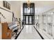 Grand foyer with soaring ceilings, marble floors, elegant staircase, and piano at 1500 Whitstable Ct, Lake Mary, FL 32746