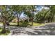 Beautiful brick home featuring mature landscaping, a circular driveway, and a welcoming front entrance at 1500 Whitstable Ct, Lake Mary, FL 32746