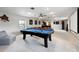 Spacious game room with a pool table, bar area, and projector screen at 1500 Whitstable Ct, Lake Mary, FL 32746