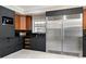 Modern kitchen featuring stainless steel appliances and dark cabinetry at 1500 Whitstable Ct, Lake Mary, FL 32746