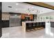 Contemporary kitchen features a large center island, sleek cabinetry, and stainless steel appliances at 1500 Whitstable Ct, Lake Mary, FL 32746