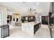 Bright, open kitchen and dining area with stone floors and high-end appliances at 1500 Whitstable Ct, Lake Mary, FL 32746
