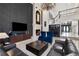 Living room with high ceilings, fireplace, bar, and leather furniture at 1500 Whitstable Ct, Lake Mary, FL 32746