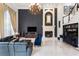 Living room with high ceilings, fireplace, bar, and leather furniture at 1500 Whitstable Ct, Lake Mary, FL 32746