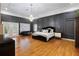 Spacious main bedroom features hardwood floors, accent wall and a chandelier at 1500 Whitstable Ct, Lake Mary, FL 32746