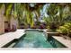 Backyard pool surrounded by lush greenery, offering a private and tranquil oasis at 1500 Whitstable Ct, Lake Mary, FL 32746