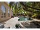 Lush backyard with pool, patio, and mature landscaping at 1500 Whitstable Ct, Lake Mary, FL 32746