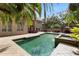 Sparkling pool with palm trees, patio with outdoor seating, and lush landscaping perfect for entertaining at 1500 Whitstable Ct, Lake Mary, FL 32746