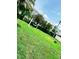 Serene backyard oasis with lush green grass and a relaxing hammock for lazy afternoons at 1511 Leeway Ave, Orlando, FL 32810