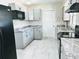 Updated kitchen with granite countertops, modern appliances, and ample cabinet space at 1511 Leeway Ave, Orlando, FL 32810