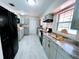 Bright kitchen featuring stone countertops, stainless steel appliances, and plenty of room for cooking at 1511 Leeway Ave, Orlando, FL 32810