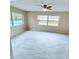 Bright main bedroom with tile flooring and large windows offering beautiful views of the outdoor area at 1511 Leeway Ave, Orlando, FL 32810