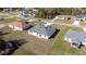 Aerial view of a single-story home with a gray roof and white exterior at 15499 Sw 48Th Ave, Ocala, FL 34473