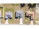 Aerial view of a single-story home with a gray roof and white exterior at 15499 Sw 48Th Ave, Ocala, FL 34473