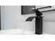 Close up of a sleek black bathroom faucet running water at 15499 Sw 48Th Ave, Ocala, FL 34473
