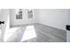 Bedroom featuring hard surface floors, natural light, and white walls at 15499 Sw 48Th Ave, Ocala, FL 34473