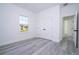 Bright bedroom featuring luxury vinyl plank flooring, a window, and a closet with white doors at 15499 Sw 48Th Ave, Ocala, FL 34473