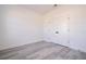 Neutral bedroom featuring a closet with white doors and gray wood-look flooring at 15499 Sw 48Th Ave, Ocala, FL 34473