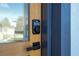 Close-up of the front door with an electronic lock at 15499 Sw 48Th Ave, Ocala, FL 34473