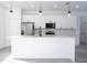 Beautiful kitchen with stainless steel appliances, a large island, and sleek finishes at 15499 Sw 48Th Ave, Ocala, FL 34473