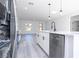 Well-lit kitchen with stainless steel appliances and a large island, open to living area at 15499 Sw 48Th Ave, Ocala, FL 34473
