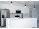 Modern kitchen with stainless steel appliances and white cabinets, well-lit at 15499 Sw 48Th Ave, Ocala, FL 34473