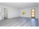 View of an open-concept living room with hard surface flooring and natural light at 15499 Sw 48Th Ave, Ocala, FL 34473