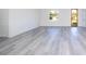 Hard surface flooring in the living room with natural light from the window at 15499 Sw 48Th Ave, Ocala, FL 34473