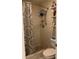 Compact bathroom features a step-in shower and modern fixtures at 1663 Sunburst Way, Kissimmee, FL 34744