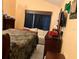Cozy bedroom featuring a comfortable bed and a dresser with ample storage at 1663 Sunburst Way, Kissimmee, FL 34744