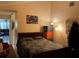 Bedroom with a comfortable bed, bright lighting, and neutral-colored walls at 1663 Sunburst Way, Kissimmee, FL 34744