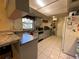 Traditional kitchen with light cabinets, granite countertops, and stainless steel appliances at 1663 Sunburst Way, Kissimmee, FL 34744