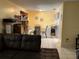Bright and airy living area with open access to the dining area with natural lighting at 1663 Sunburst Way, Kissimmee, FL 34744