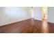 Bedroom featuring wood floors and an ensuite bathroom at 1695 Lee Rd # E205, Winter Park, FL 32789