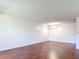 Bright living room features sleek, modern flooring and neutral walls that provide a blank canvas at 1695 Lee Rd # E205, Winter Park, FL 32789