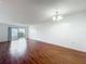 Bright living space featuring smooth hardwood floors and access to a private balcony at 1695 Lee Rd # E205, Winter Park, FL 32789