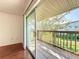 Private wood patio connects to the interior and outdoor green space at 1695 Lee Rd # E205, Winter Park, FL 32789