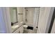 Bright bathroom featuring granite counters, tub with shower, and stylish black hardware at 18410 Blue Heron Cir, Deer Island, FL 32778